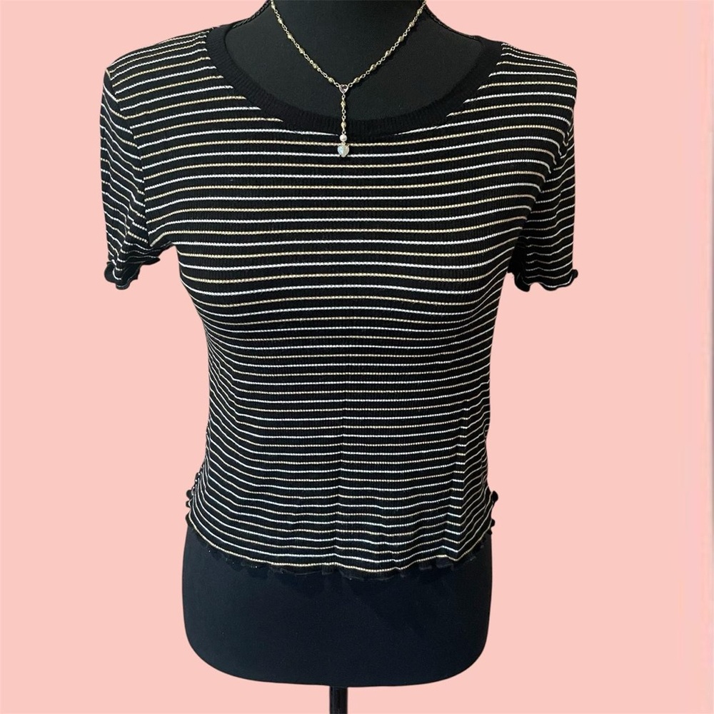 Black and white striped top with ruffle detail